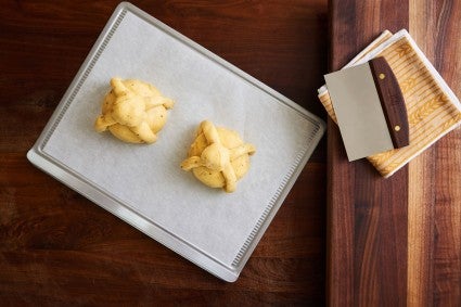 Unbaked, shaped Pan de Muerto dough