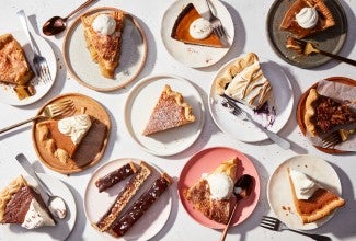 Multiple different slices of pie on plates